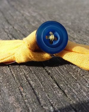 barrette cheveux noeud jaune bouton bleu